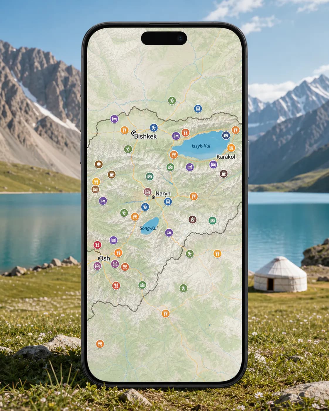 A phone showing the Peakd Kyrgyzstan map in the mountains